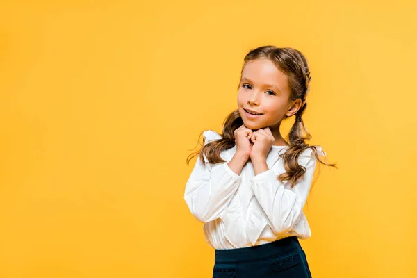 Happy and cute kid looking at camera isolated on orange — Stock Photo