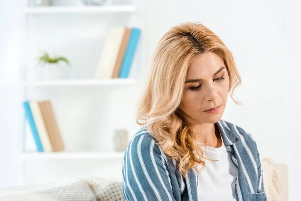 Frustrated woman with bad mood in living room — Stock Photo