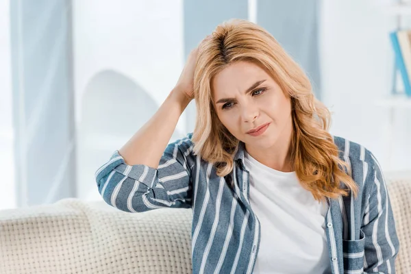 Tired woman touching head and having headache at home — Stock Photo