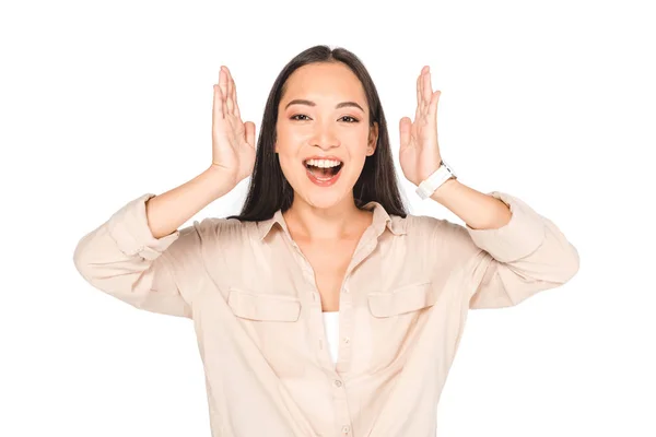 Happy asian woman gesturing while looking at camera isolated on white — Stock Photo