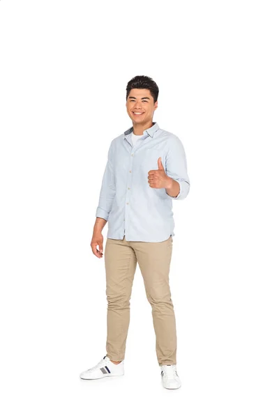 Handsome asian man showing thumb up while smiling at camera on white background — Stock Photo