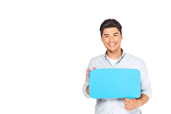 Young asian man holding speech bubble while looking at camera isolated on white — Stock Photo