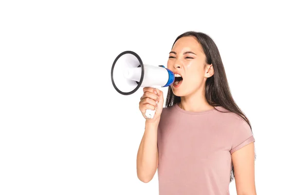 Irritated asian girl yelling into megaphone isolated on white — Stock Photo