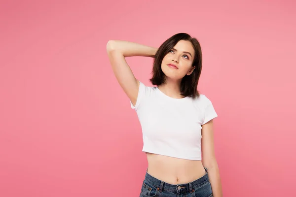 Beautiful dreamy girl looking away isolated on pink — Stock Photo