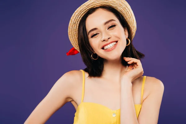 Smiling girl in straw hat isolated on purple — Stock Photo