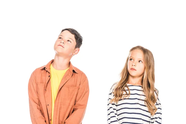 Two pensive kids looking up isolated on white — Stock Photo