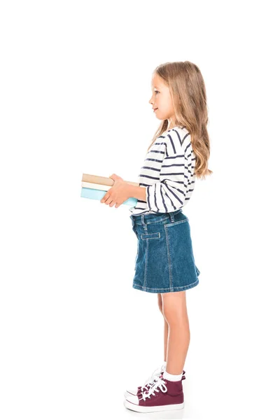 Side view of smiling kid with books isolated on white — Stock Photo