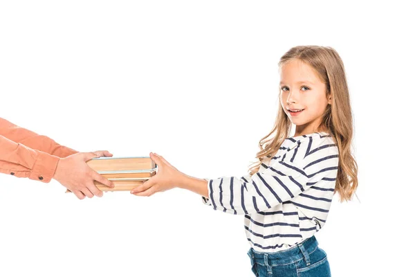 Vista parcial de dos niños con libros aislados en blanco - foto de stock