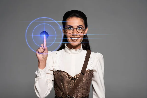 Front view of excited attractive steampunk woman showing idea sign isolated on grey — Stock Photo