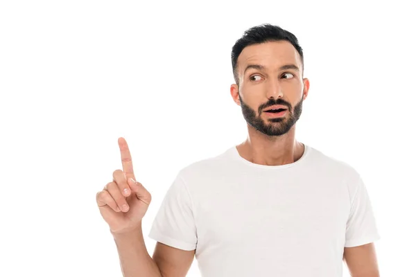 Surprised bearded man pointing with finger isolated on white — Stock Photo