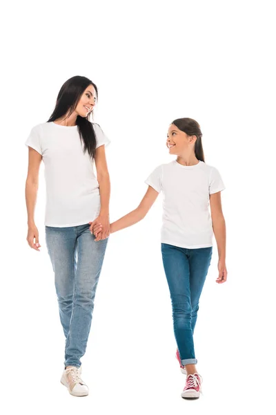 Happy mother and daughter holding hands isolated on white — Stock Photo