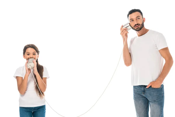 Kid holding tin can and playing with handsome father isolated on while — Stock Photo