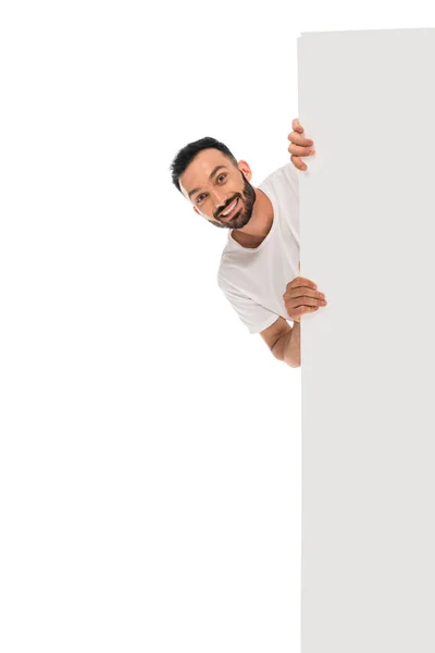 Cheerful man smiling while holding placard isolated on white — Stock Photo