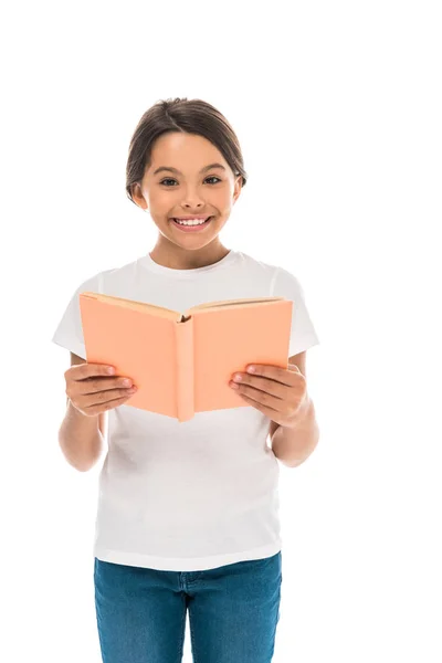 Cheerful kid holding book isolated on white — Stock Photo