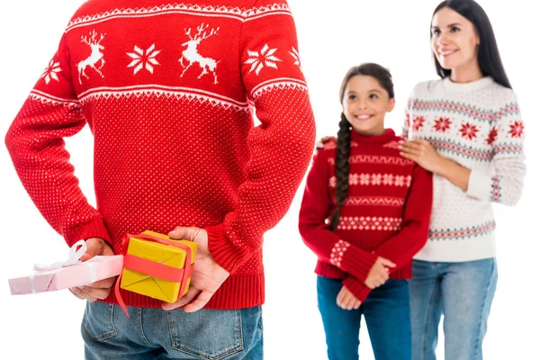 Cropped view of man holding presents near wife and daughter isolated on white — Stock Photo