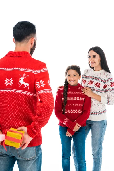 Back view of man holding presents near wife and daughter isolated on white — Stock Photo