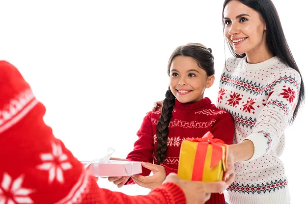Cropped view of man giving presents to wife and daughter isolated on white — Stock Photo