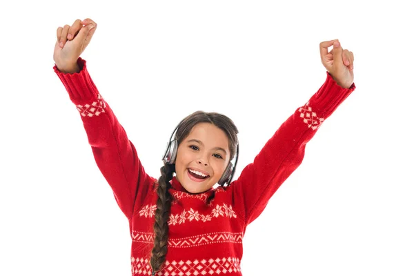 Happy kid in headphones with hands above head isolated on white — Stock Photo