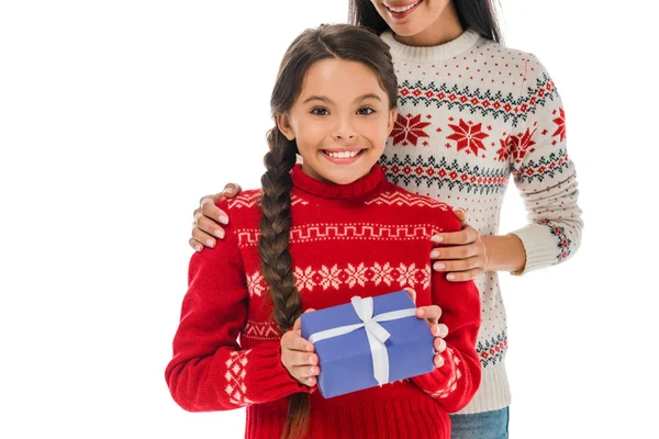 Cropped view of cheerful mother near happy daughter with present isolated on white — Stock Photo