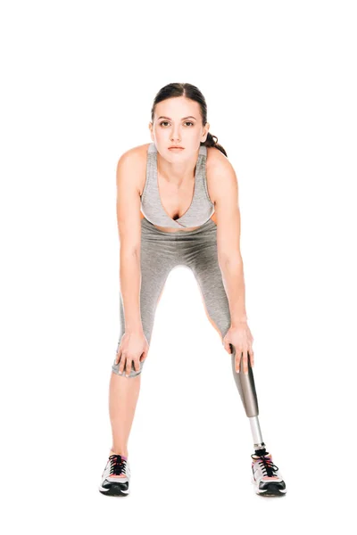 Front view of disabled sportswoman with prosthetic leg isolated on white — Stock Photo