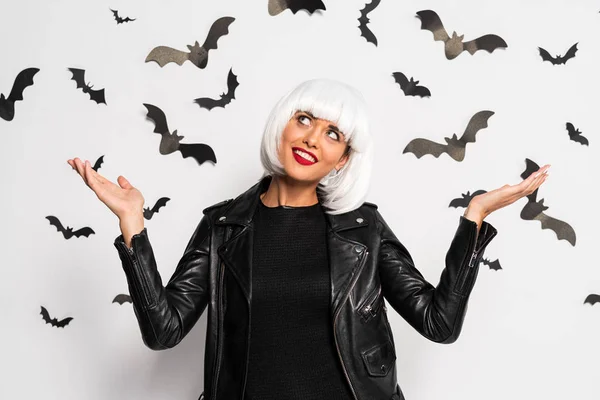 Attractive woman in white wig with outstretched hands in Halloween — Stock Photo