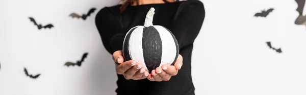 Panoramic shot of woman holding pumpkin in Halloween — Stock Photo