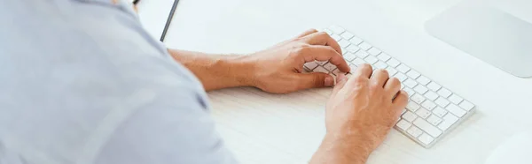 Panoramic shot of broker typing on computer keyboard in office — Stock Photo