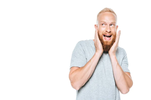 Handsome frightened bearded man, isolated on white — Stock Photo