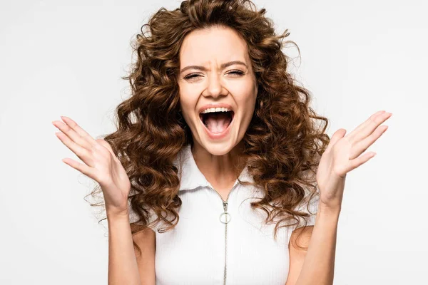 Excited curly girl screaming in white t-shirt, isolated on white — Stock Photo