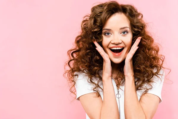Beautiful excited curly girl, isolated on pink — Stock Photo