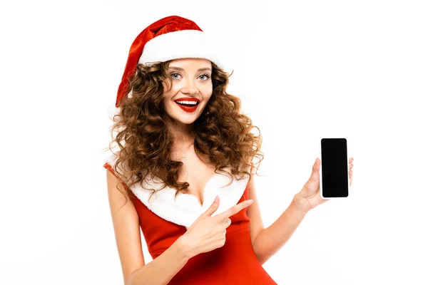 Femme souriante en costume de Père Noël pointant vers le smartphone avec écran blanc, isolé sur blanc — Photo de stock