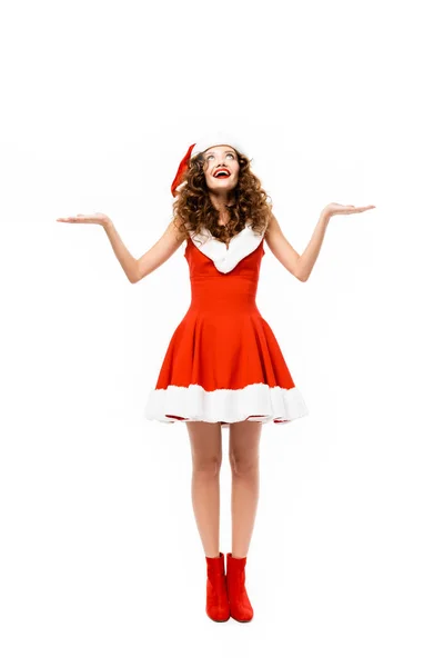 Chica feliz posando en traje de santa y gesto, aislado en blanco - foto de stock