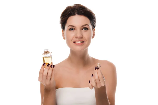 Happy woman holding glass bottle with oil isolated on white — Stock Photo