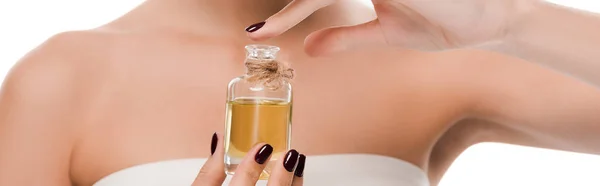 Panoramic shot of woman holding bottle with oil isolated on white — Stock Photo