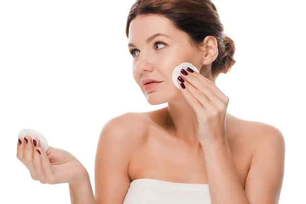 Attractive woman holding cotton pads isolated on white — Stock Photo