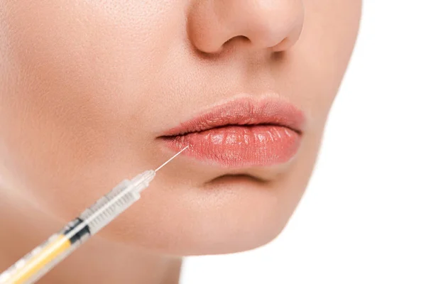 Close up of woman near syringe isolated on white — Stock Photo