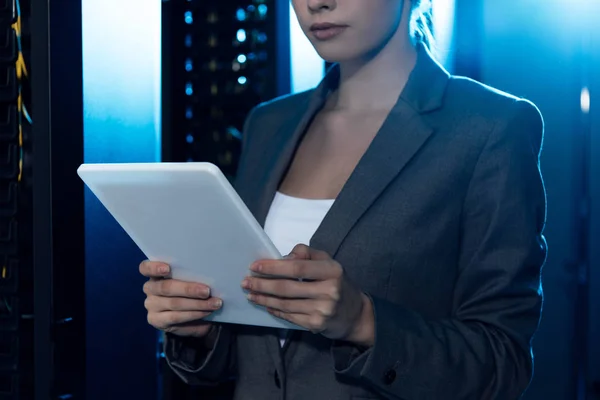 Cropped view of businesswoman using digital tablet in data center — Stock Photo