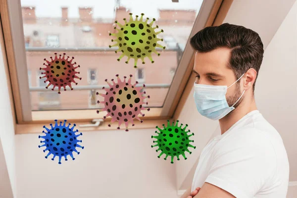 Side view of man in medical mask standing near window at home, bacteria illustration — Stock Photo