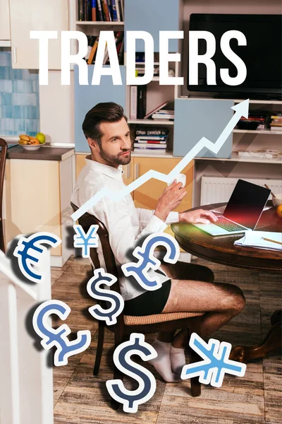 Selective focus of handsome man in shirt and panties using laptop and holding cup in living room, traders illustration — Stock Photo