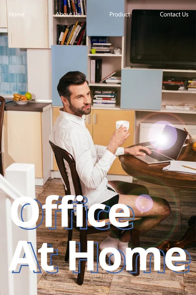 Selective focus of handsome man in shirt and panties using laptop and holding cup in living room, office at home illustration — Stock Photo