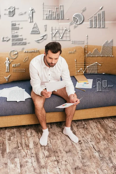 Freelancer in panties and shirt looking at documents with charts on sofa, charts and graphs illustration — Stock Photo