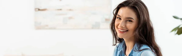 Panoramic orientation of smiling woman looking at camera at home — Stock Photo