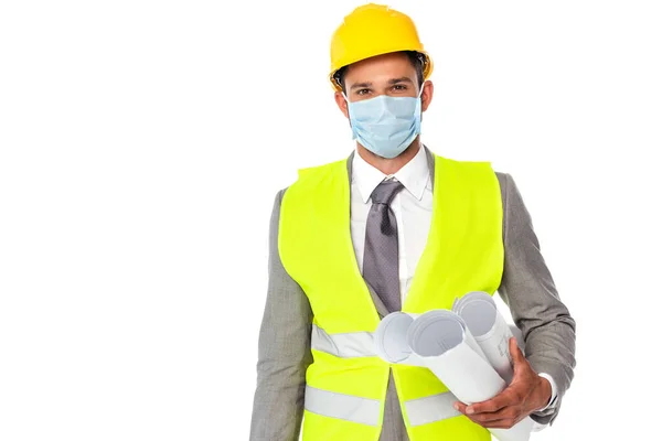 Engineer in suit and hardhat holding blueprints and looking at camera isolated on white — Stock Photo