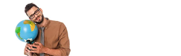 Panoramic shot of positive teacher looking at camera while holding globe isolated on white — Stock Photo