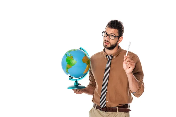 Handsome bearded teacher looking at camera and holding globe with pen isolated on white — Stock Photo