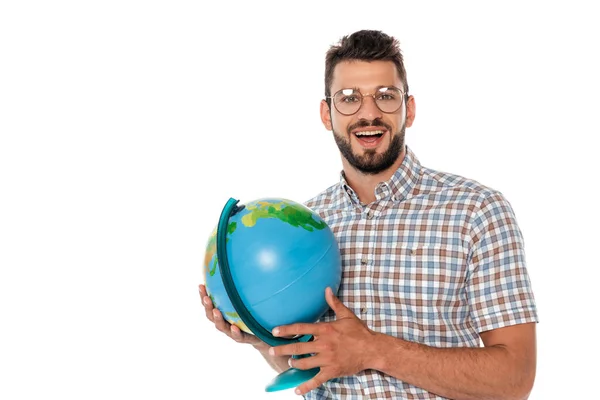 Smiling nerd looking at camera while holding globe isolated on white — Stock Photo