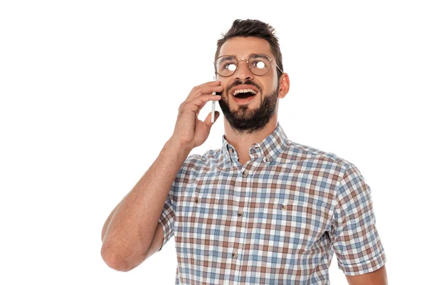 Positive nerd talking on smartphone isolated on white — Stock Photo