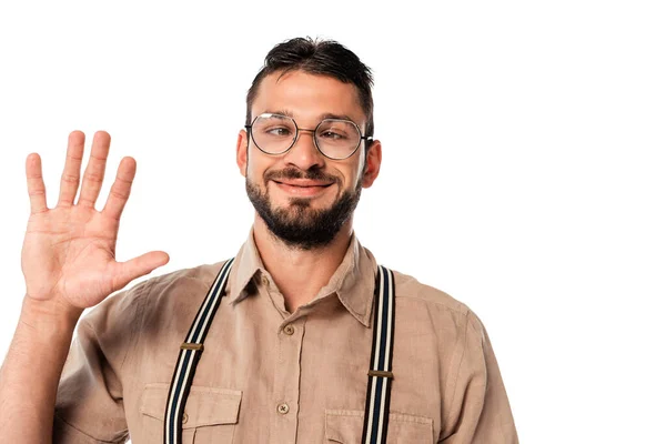 Lächelnder Strabismus-Nerd mit Brille, winkende Hand auf weißem Hintergrund — Stockfoto