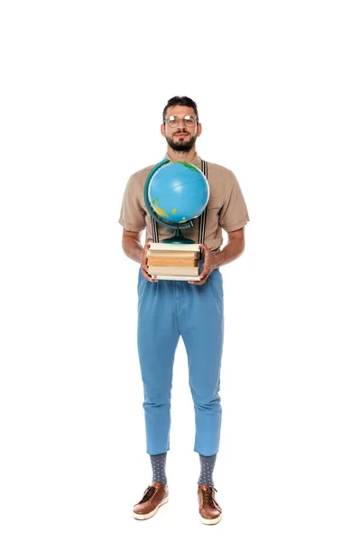 Handsome nerd holding books and globe and looking at camera on white background — Stock Photo