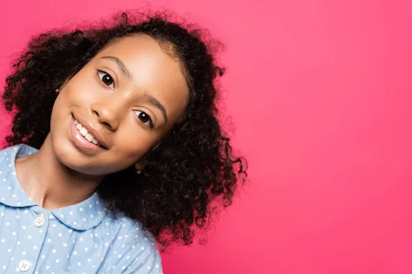 Smiling cute curly african american kid looking at camera isolated on pink — Stock Photo